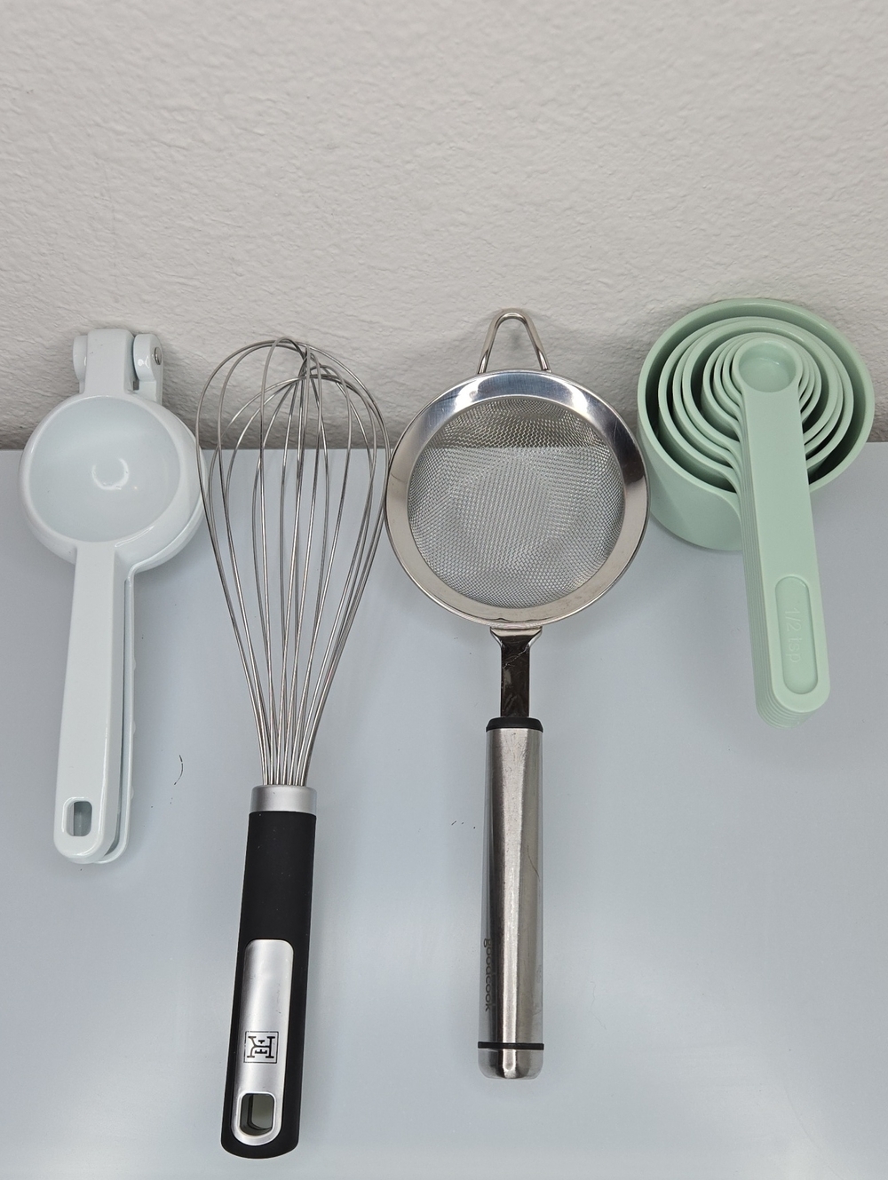 4 Piece Baking/Cooking Set Whisk, Measuring Cups, Citrus Press, Mesh Strainer